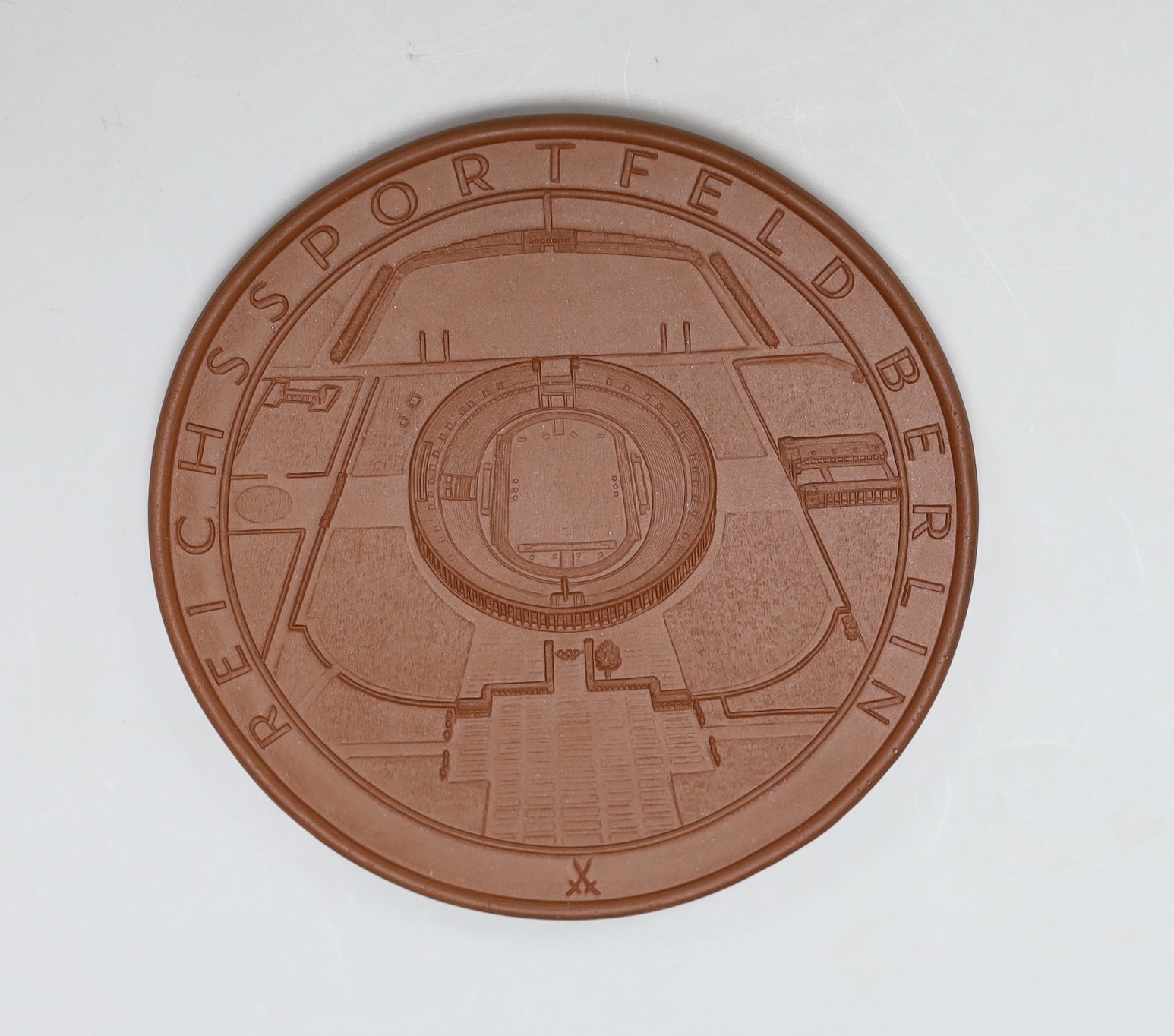 A cased Meissen Bottger stoneware 1936 Olympics Berlin commemorative medal. 12cm diameter